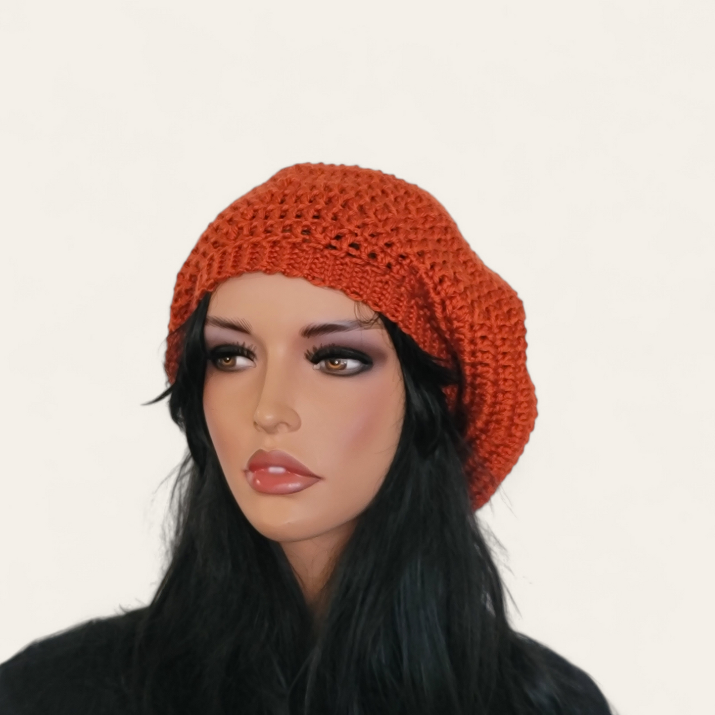 Rusty orange crocheted beret without pom-pom on mannequin