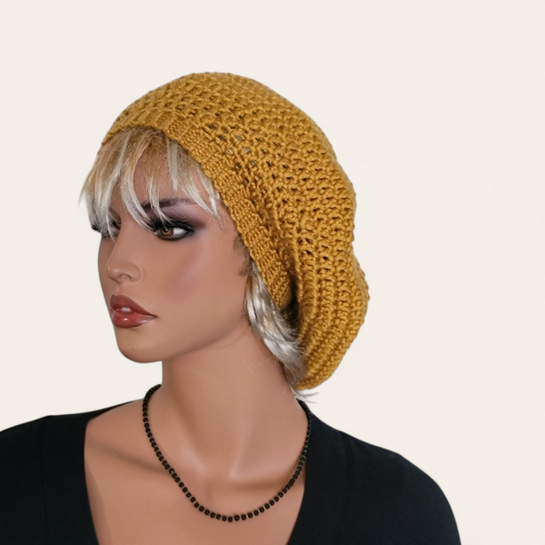 Gold crocheted beret without pom-pom on mannequin